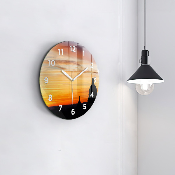 Round glass wall clock Building and sunset