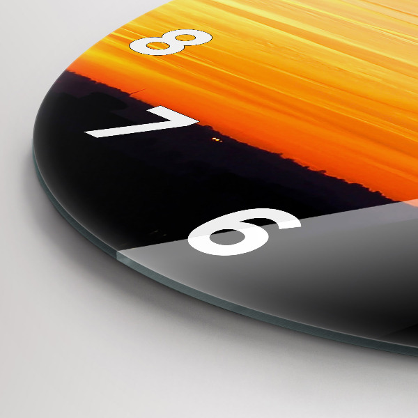Round glass wall clock Building and sunset