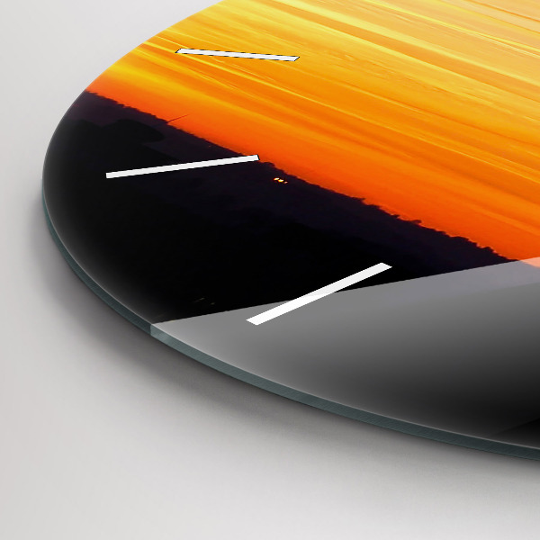 Round glass wall clock Building and sunset