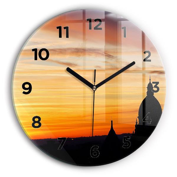 Round glass wall clock Building and sunset