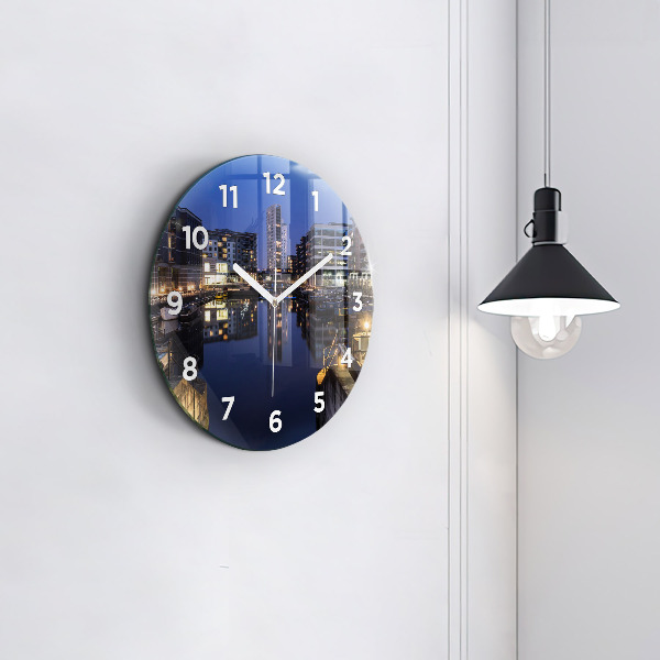Round glass wall clock The city lit up at night