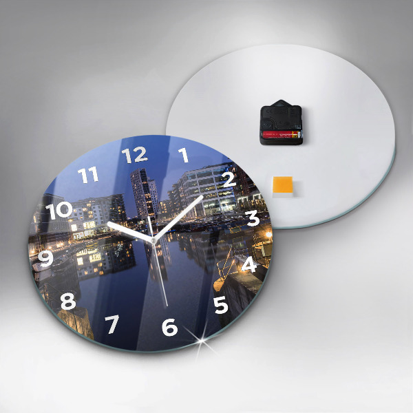Round glass wall clock The city lit up at night