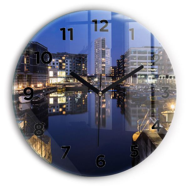Round glass wall clock The city lit up at night