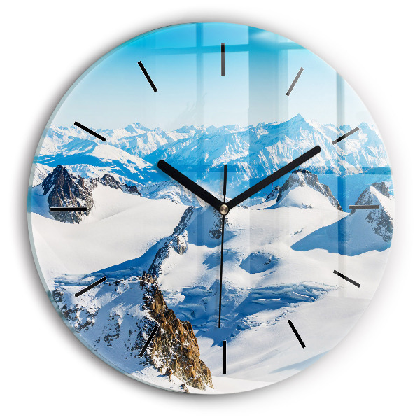 Round glass wall clock Skier in the Alps