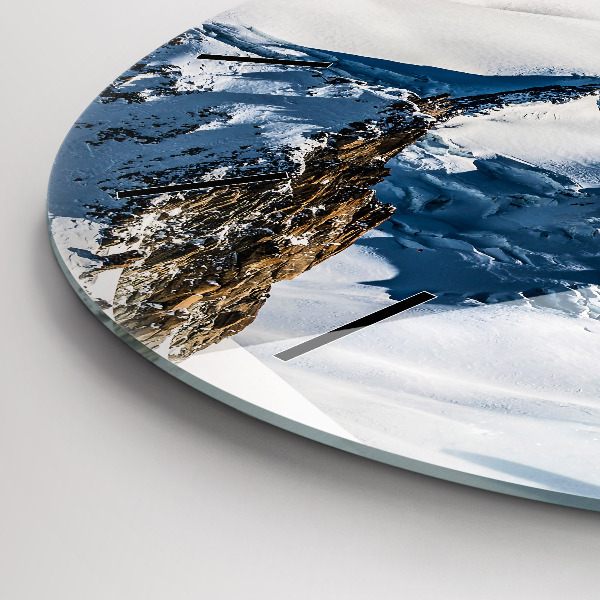 Round glass wall clock Skier in the Alps