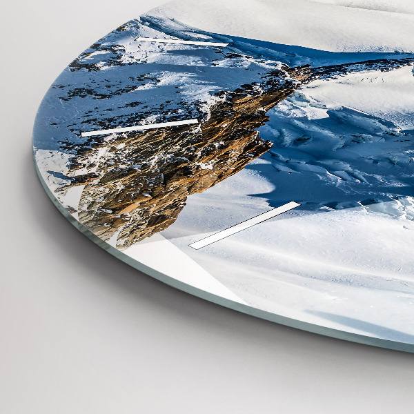 Round glass wall clock Skier in the Alps