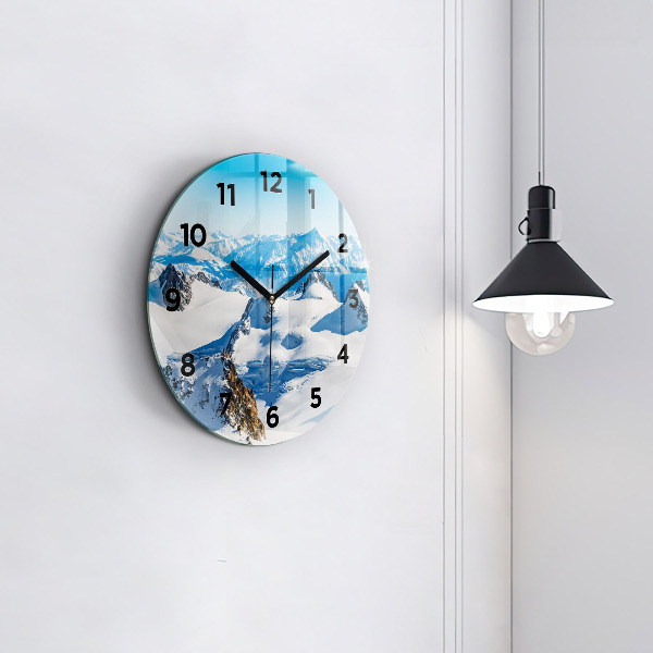 Round glass wall clock Skier in the Alps