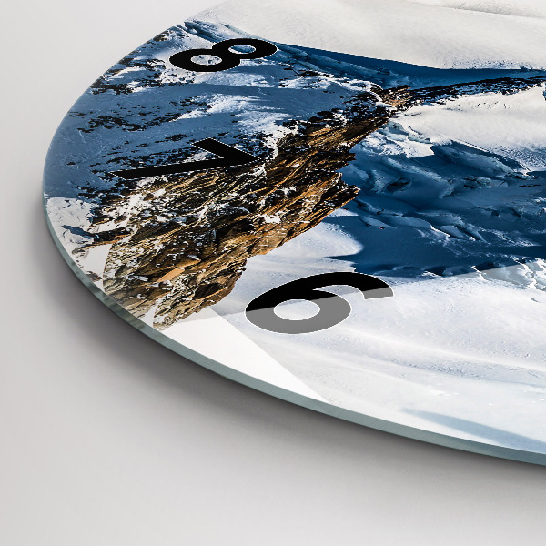 Round glass wall clock Skier in the Alps