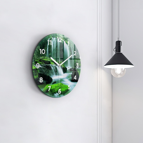Round glass wall clock Waterfall among the moss