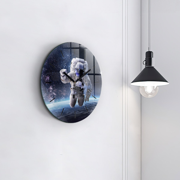 Round glass wall clock Astronaut above the earth