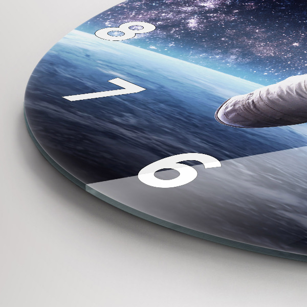 Round glass wall clock Astronaut above the earth