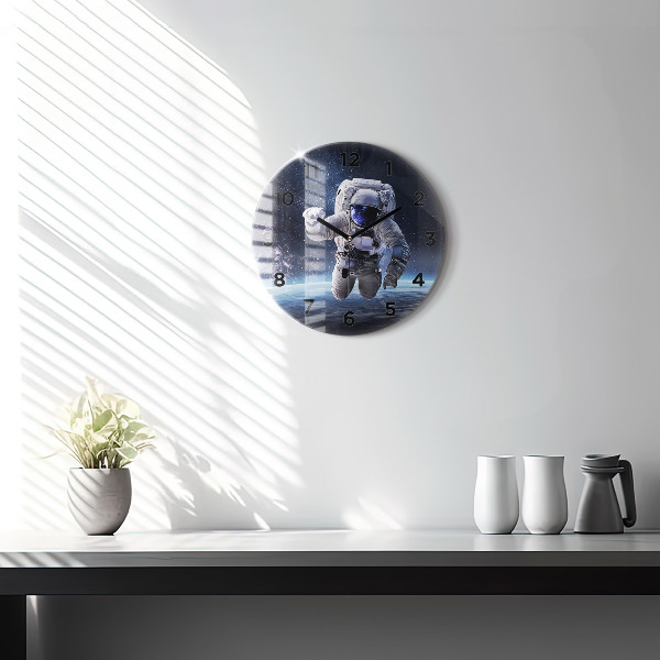 Round glass wall clock Astronaut above the earth