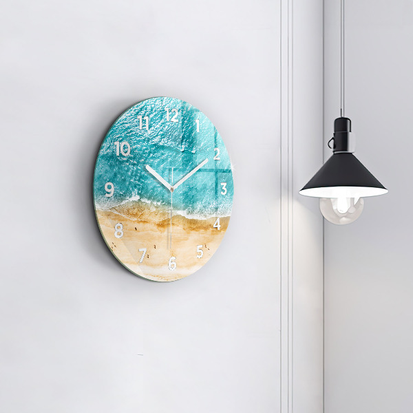 Round glass wall clock sea beach people