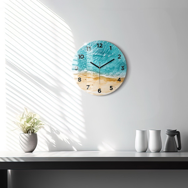 Round glass wall clock sea beach people