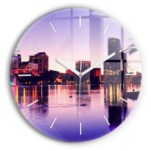 Round glass wall clock Evening panorama of the city