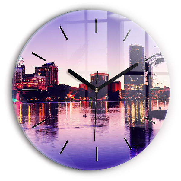 Round glass wall clock Evening panorama of the city