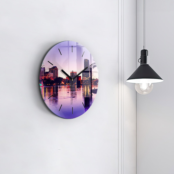 Round glass wall clock Evening panorama of the city
