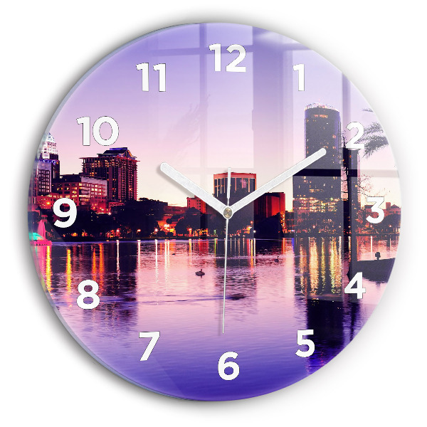 Round glass wall clock Evening panorama of the city