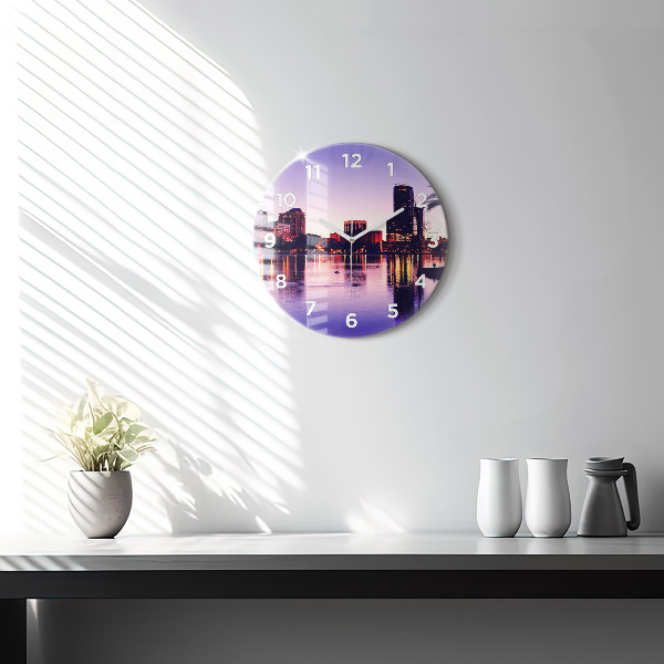 Round glass wall clock Evening panorama of the city