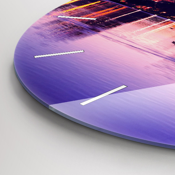 Round glass wall clock Evening panorama of the city