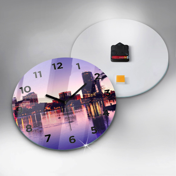 Round glass wall clock Evening panorama of the city